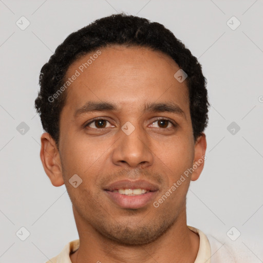 Joyful latino young-adult male with short  brown hair and brown eyes