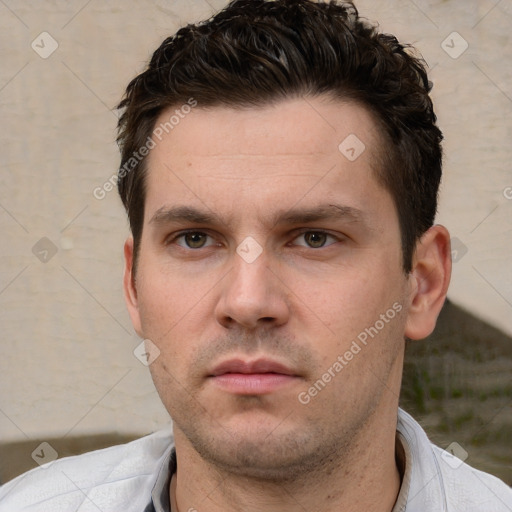 Neutral white young-adult male with short  brown hair and brown eyes