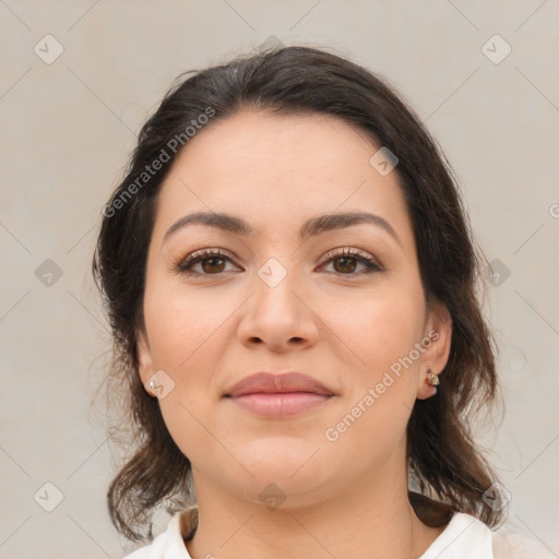 Joyful white young-adult female with medium  brown hair and brown eyes