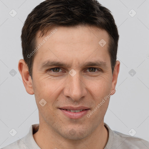 Joyful white adult male with short  brown hair and brown eyes