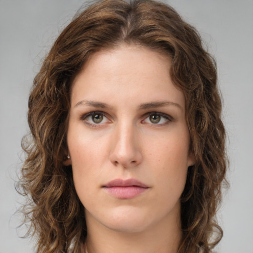 Neutral white young-adult female with medium  brown hair and green eyes