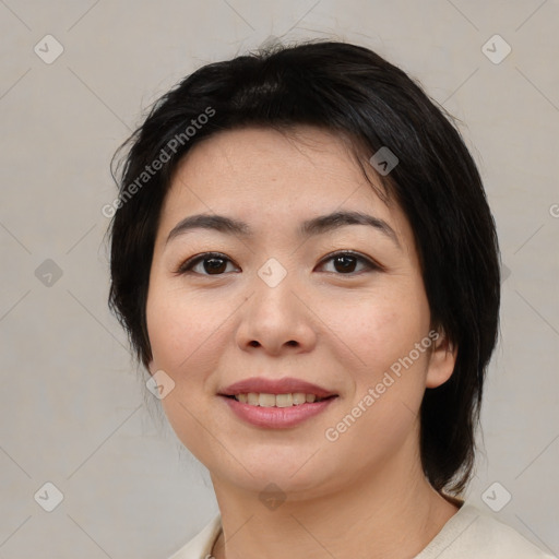 Joyful asian young-adult female with medium  brown hair and brown eyes