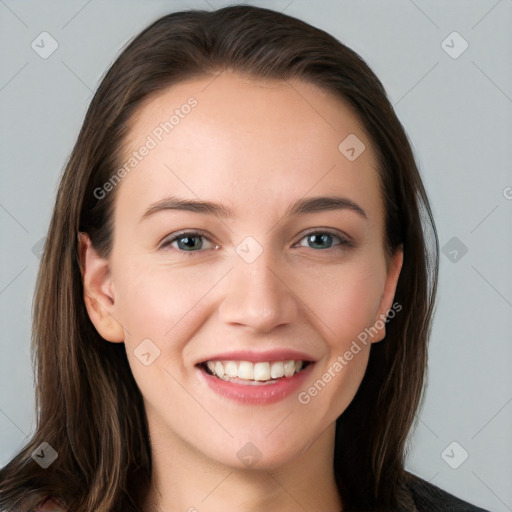 Joyful white young-adult female with long  brown hair and grey eyes