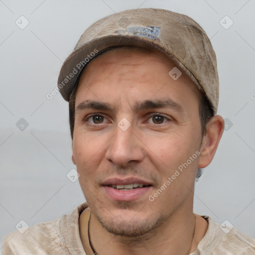 Joyful white adult male with short  brown hair and brown eyes