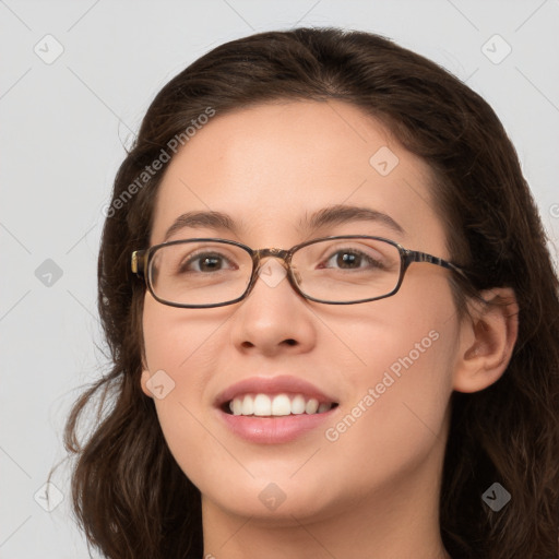 Joyful white young-adult female with long  brown hair and green eyes