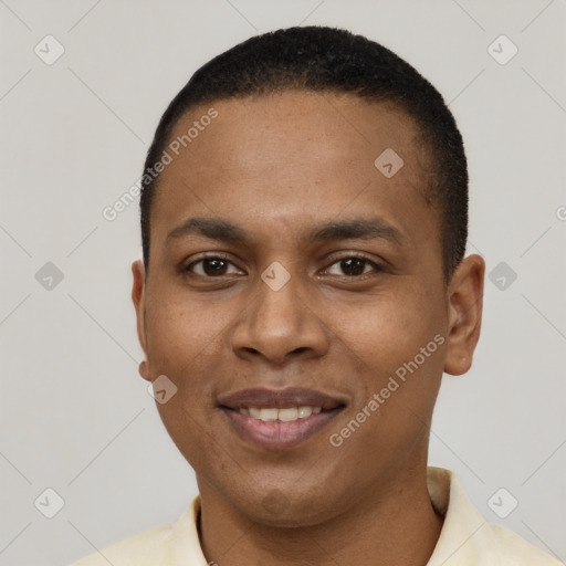 Joyful black young-adult male with short  black hair and brown eyes