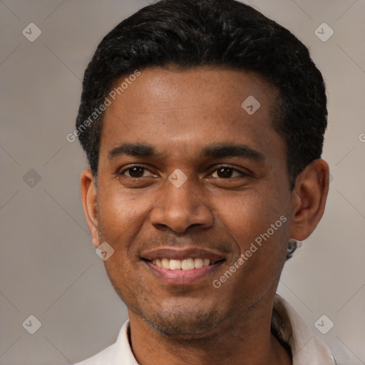 Joyful latino young-adult male with short  black hair and brown eyes
