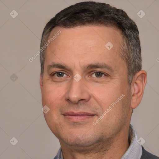 Joyful white adult male with short  brown hair and brown eyes