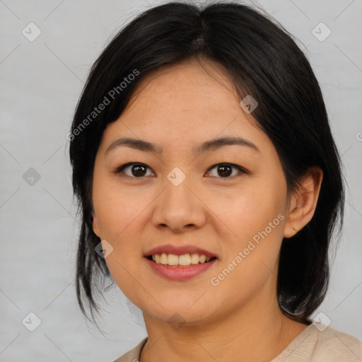 Joyful asian young-adult female with medium  black hair and brown eyes