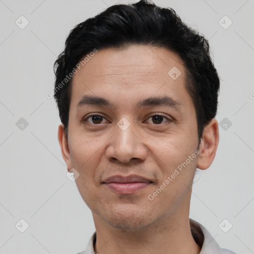 Joyful white young-adult male with short  black hair and brown eyes