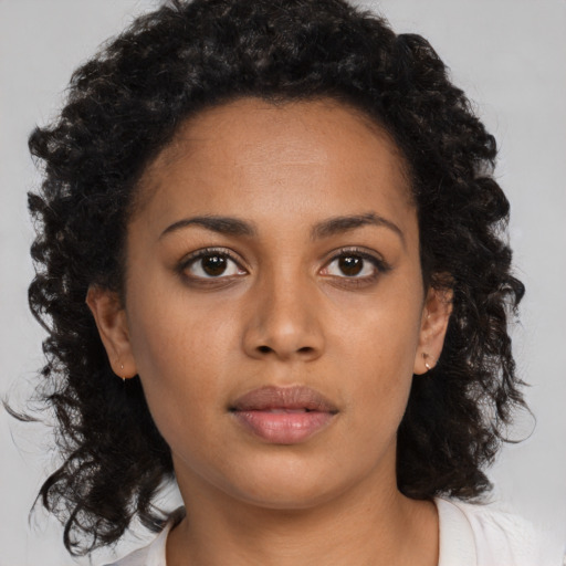 Neutral black young-adult female with medium  brown hair and brown eyes