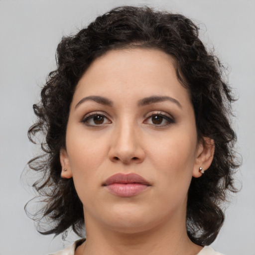 Neutral latino young-adult female with medium  brown hair and brown eyes