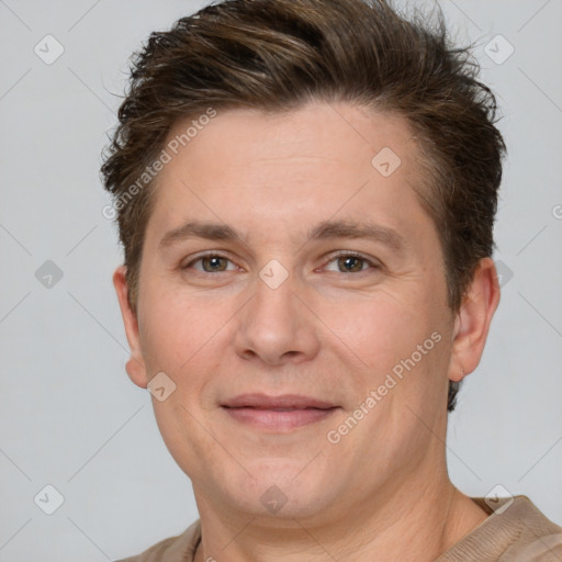 Joyful white adult male with short  brown hair and grey eyes