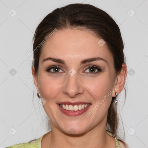 Joyful white young-adult female with medium  brown hair and green eyes