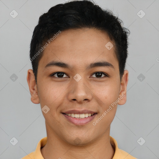 Joyful latino young-adult male with short  brown hair and brown eyes