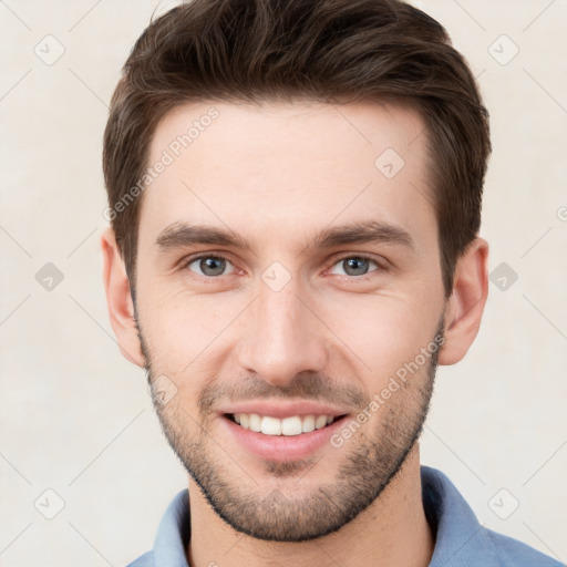 Joyful white young-adult male with short  brown hair and brown eyes