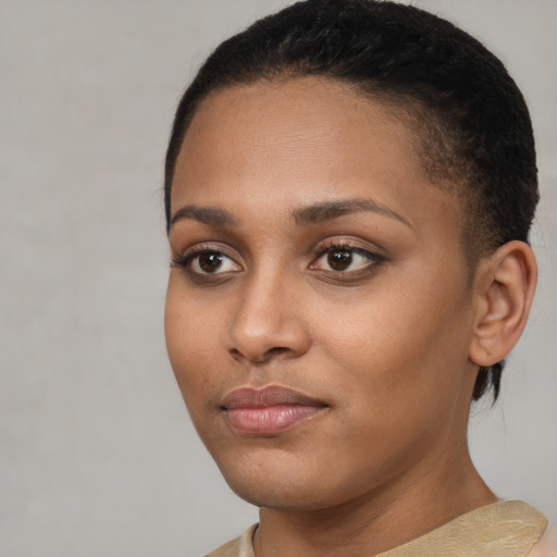 Neutral black young-adult female with short  brown hair and brown eyes