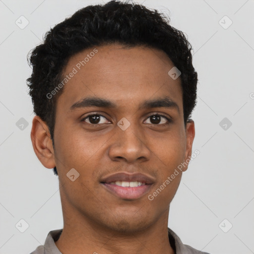 Joyful black young-adult male with short  black hair and brown eyes