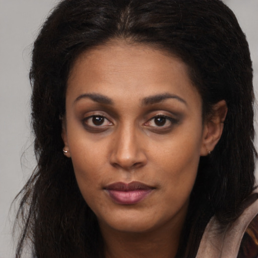 Neutral latino young-adult female with long  brown hair and brown eyes