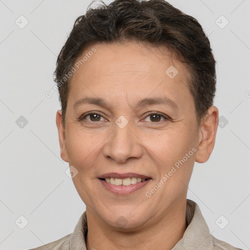 Joyful white adult female with short  brown hair and brown eyes