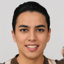 Joyful latino young-adult male with short  black hair and brown eyes