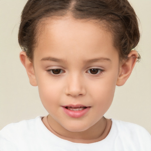 Joyful white child female with short  brown hair and brown eyes