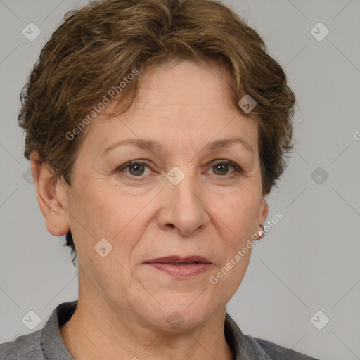 Joyful white middle-aged female with short  brown hair and grey eyes