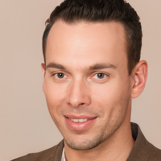 Joyful white young-adult male with short  brown hair and brown eyes