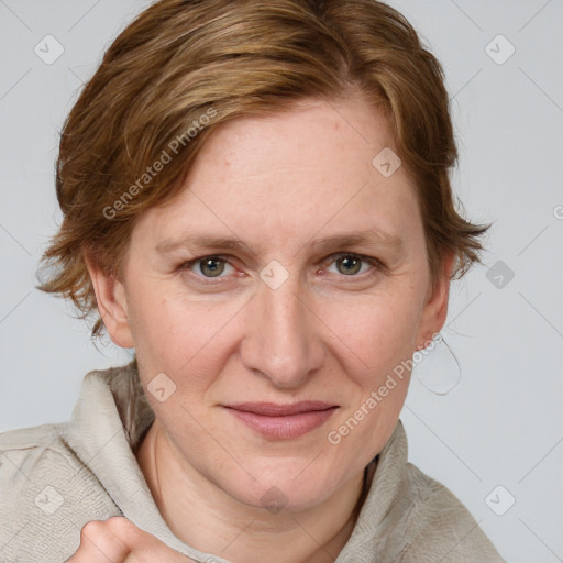 Joyful white adult female with medium  brown hair and blue eyes