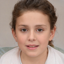 Joyful white child female with short  brown hair and brown eyes