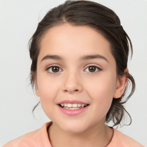 Joyful white child female with medium  brown hair and brown eyes