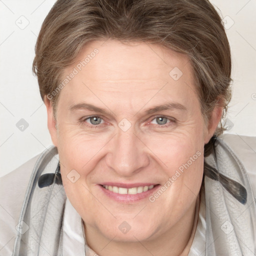 Joyful white adult female with medium  brown hair and grey eyes