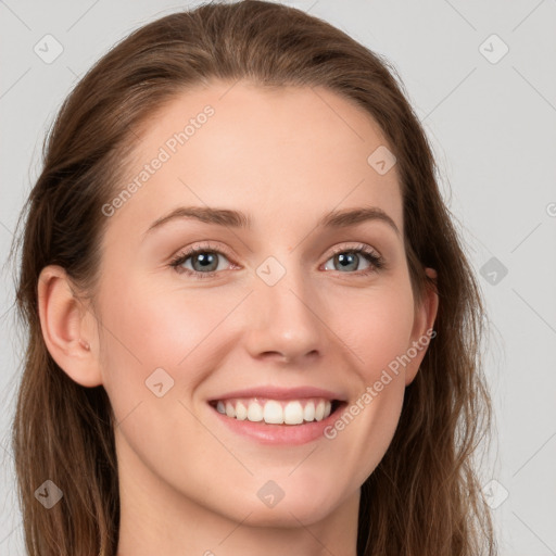 Joyful white young-adult female with long  brown hair and blue eyes