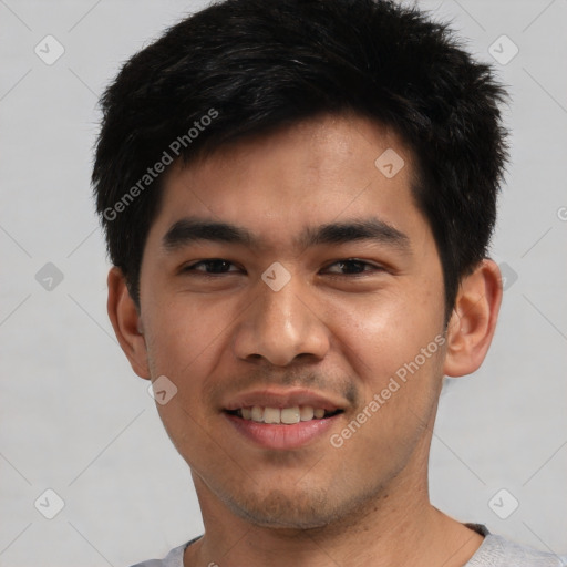 Joyful asian young-adult male with short  black hair and brown eyes