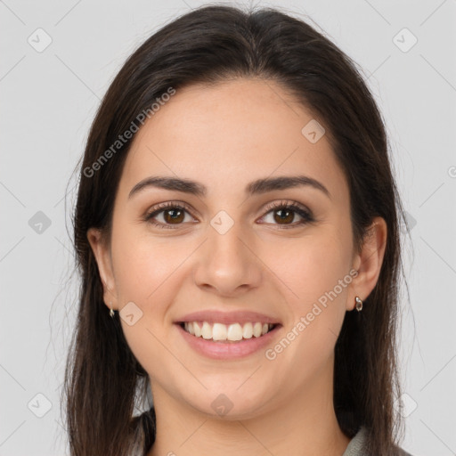 Joyful white young-adult female with long  brown hair and brown eyes