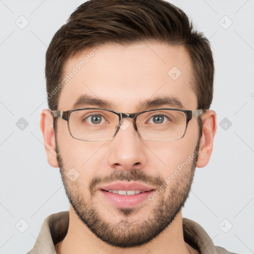 Joyful white young-adult male with short  brown hair and grey eyes