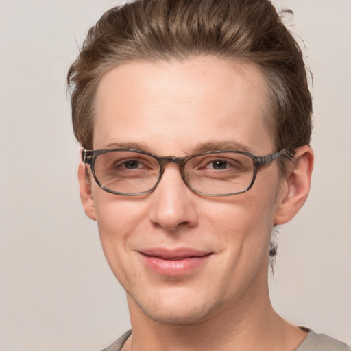 Joyful white adult male with short  brown hair and grey eyes