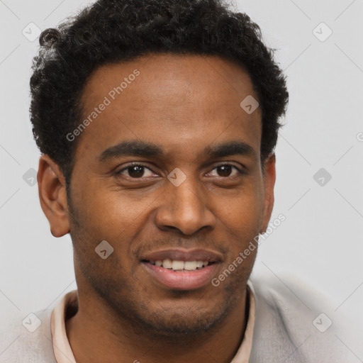 Joyful black young-adult male with short  brown hair and brown eyes