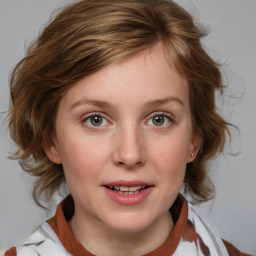 Joyful white young-adult female with medium  brown hair and blue eyes