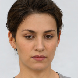 Neutral white young-adult female with short  brown hair and brown eyes