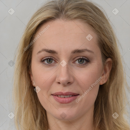 Joyful white adult female with long  brown hair and brown eyes