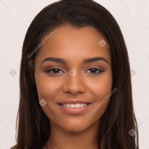 Joyful latino young-adult female with long  brown hair and brown eyes