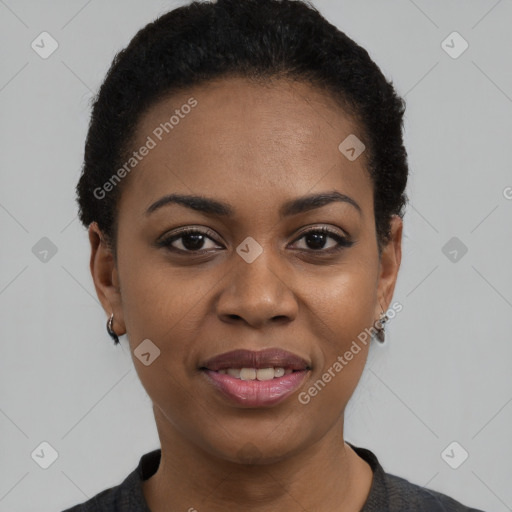 Joyful black young-adult female with short  black hair and brown eyes