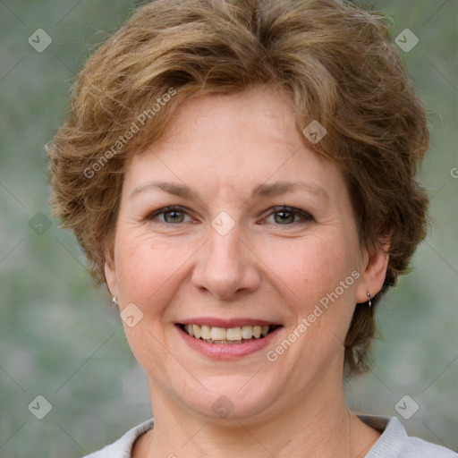 Joyful white adult female with medium  brown hair and green eyes