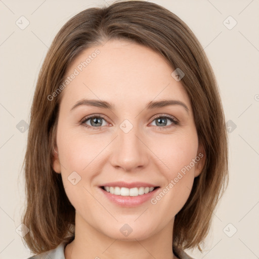 Joyful white young-adult female with medium  brown hair and green eyes