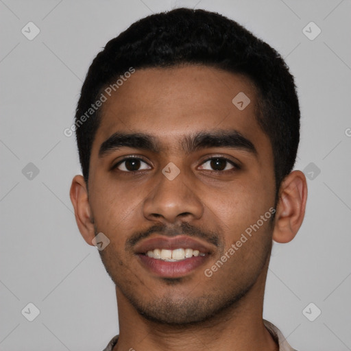 Joyful black young-adult male with short  black hair and brown eyes