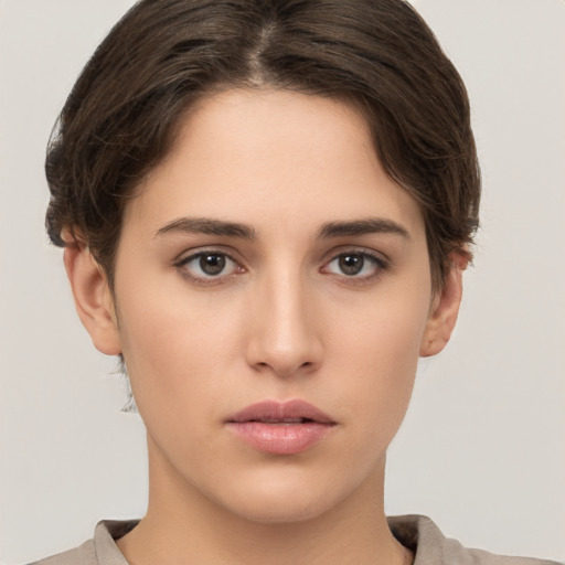 Neutral white young-adult female with short  brown hair and brown eyes