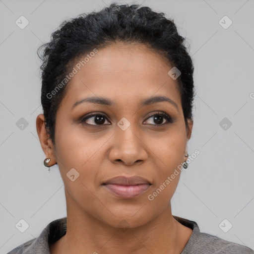 Joyful latino young-adult female with short  black hair and brown eyes