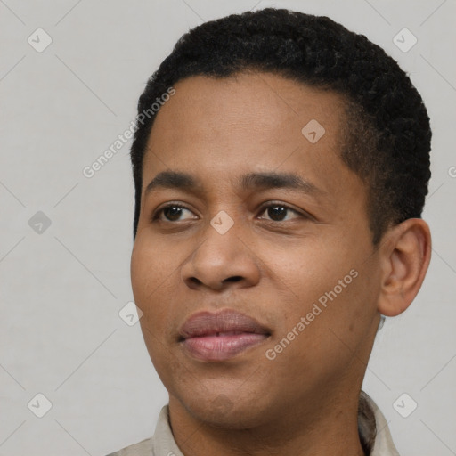 Joyful black young-adult male with short  black hair and brown eyes