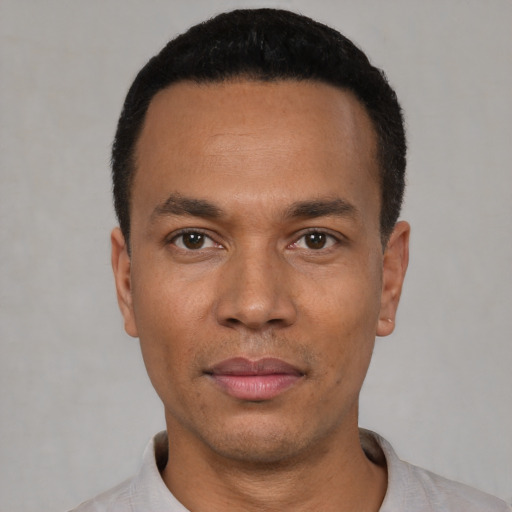 Neutral latino young-adult male with short  black hair and brown eyes